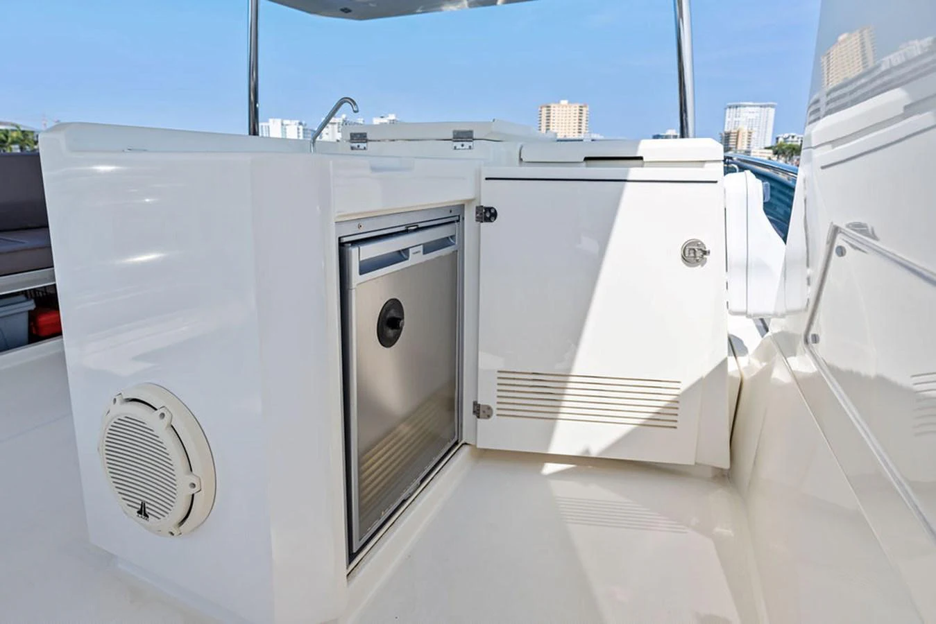 The yacht features a sleek outdoor galley with modern appliances and ample storage. aboard JOVE Yacht for Sale