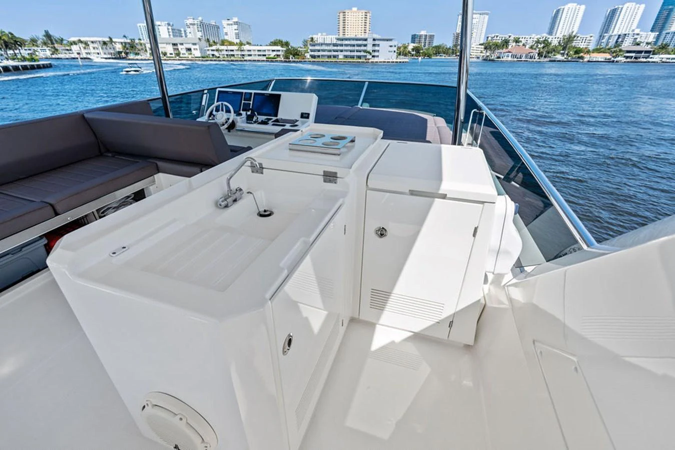 The flybridge offers a spacious and well-equipped area for outdoor enjoyment with stunning views. aboard JOVE Yacht for Sale