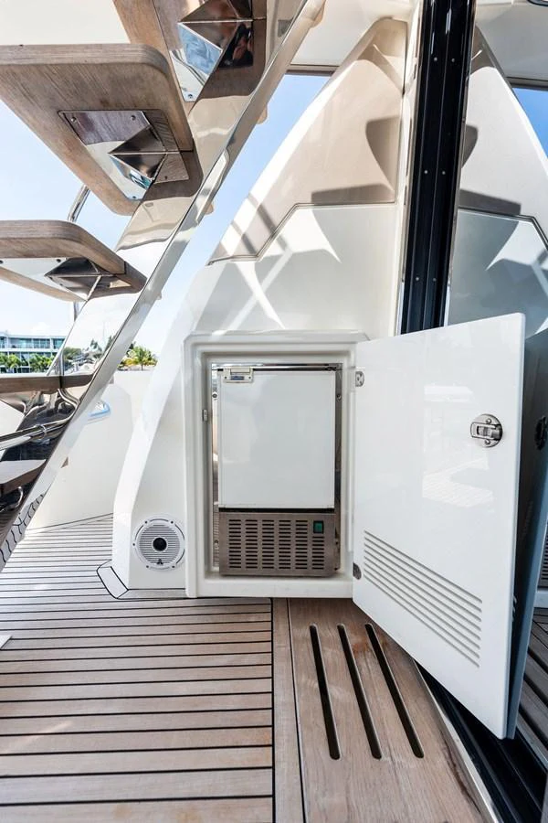 A close-up view of a yacht's built-in refrigerator on the deck, showcasing its sleek design and functionality. aboard JOVE Yacht for Sale