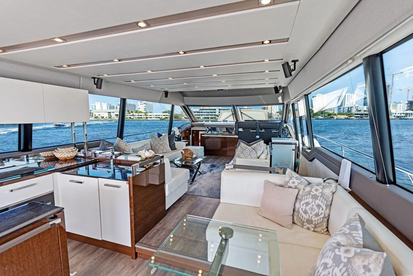 The salon offers a spacious and luxurious living area with panoramic views of the water. aboard JOVE Yacht for Sale