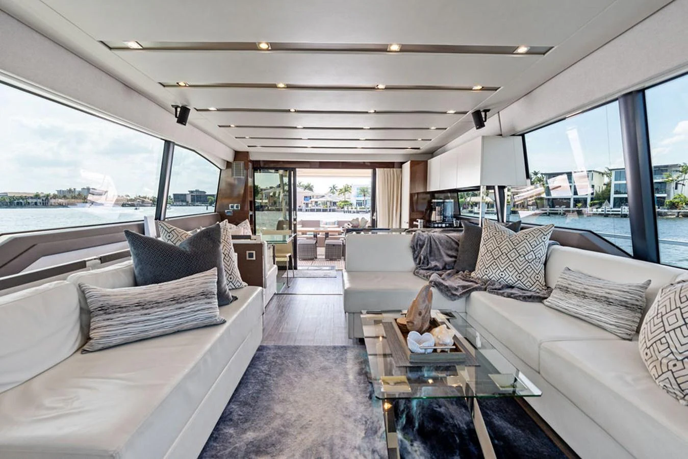 The salon offers a spacious and luxurious seating area with panoramic views. aboard JOVE Yacht for Sale