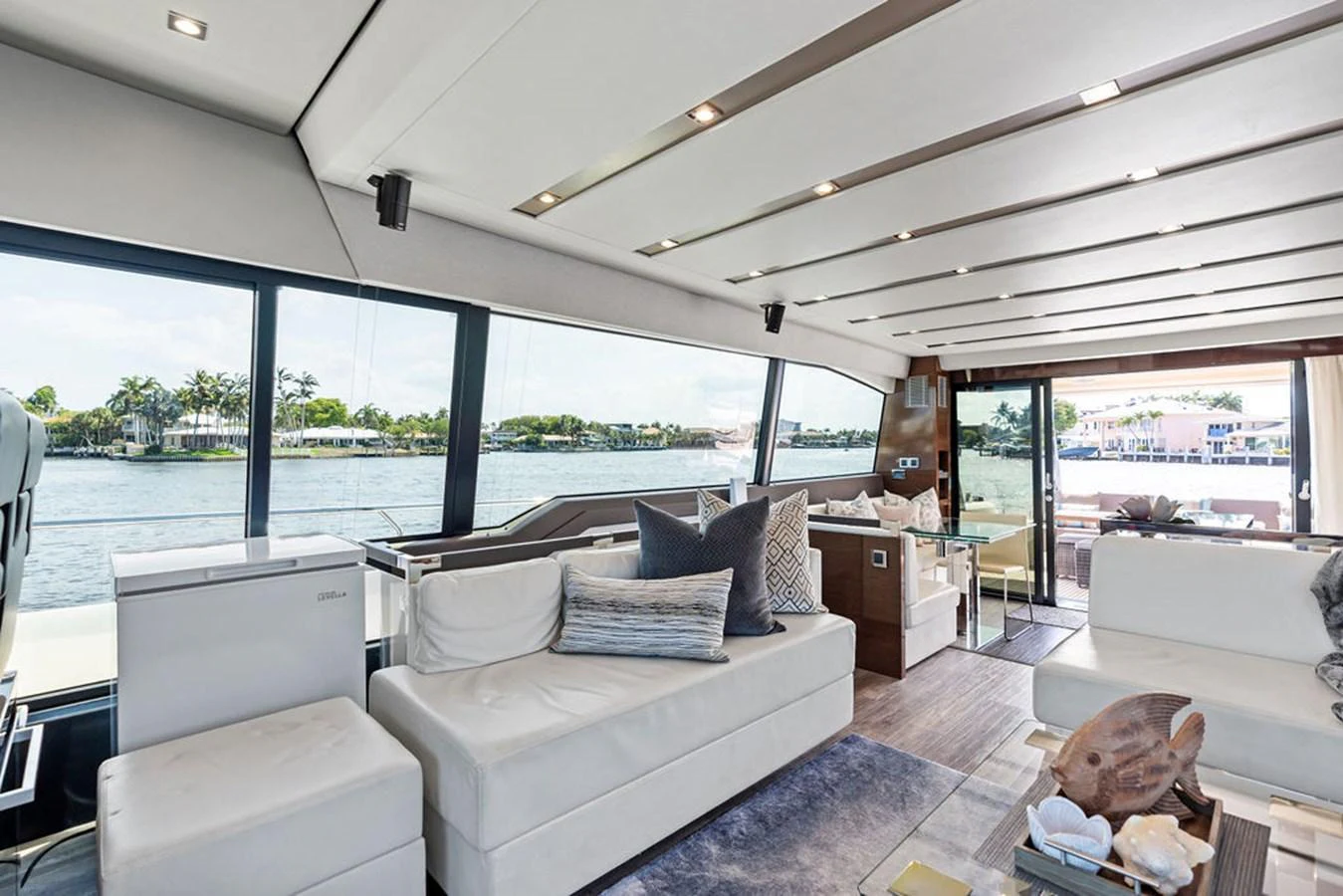The salon features plush seating, large windows, and elegant decor, offering a luxurious and comfortable space to relax. aboard JOVE Yacht for Sale