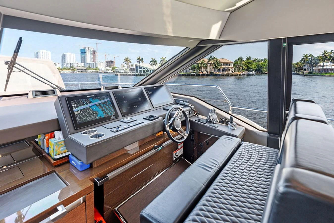 The helm station offers a sleek and modern command center with panoramic views of the water. aboard JOVE Yacht for Sale