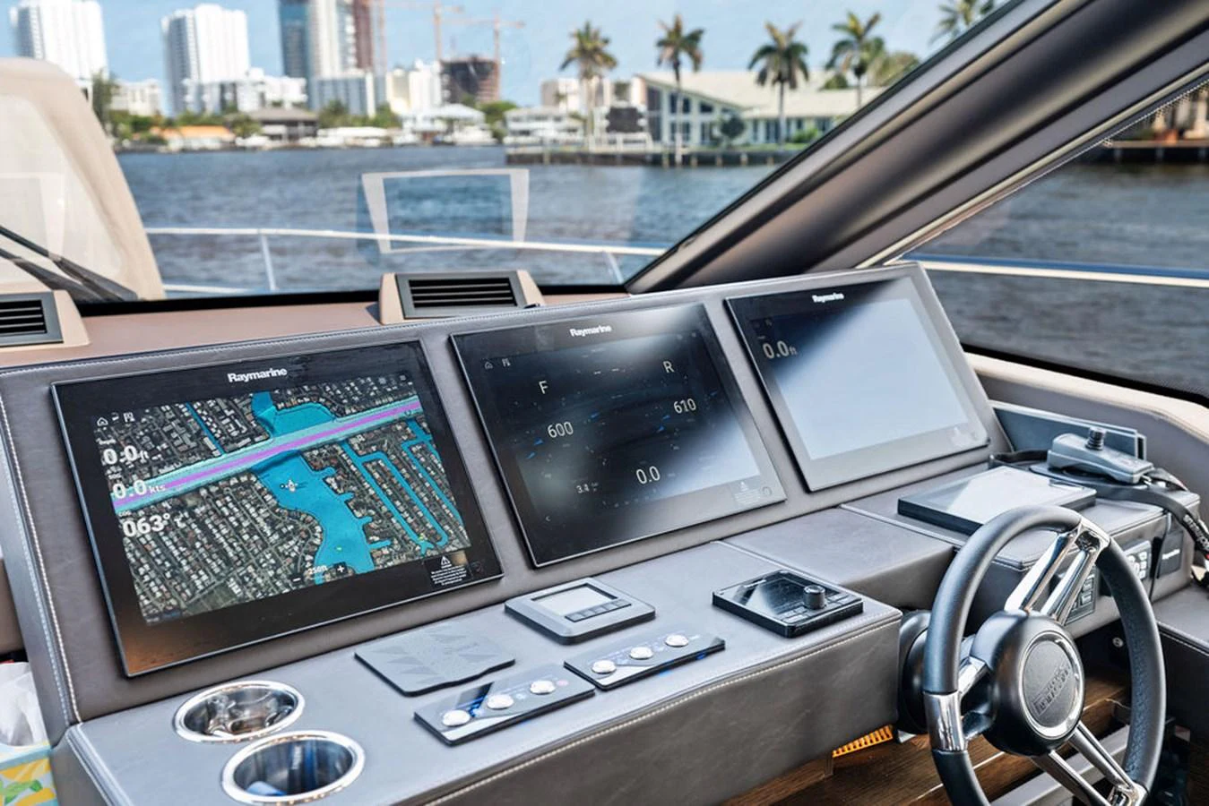 The helm station features advanced navigation and control systems with a sleek, modern design. aboard JOVE Yacht for Sale