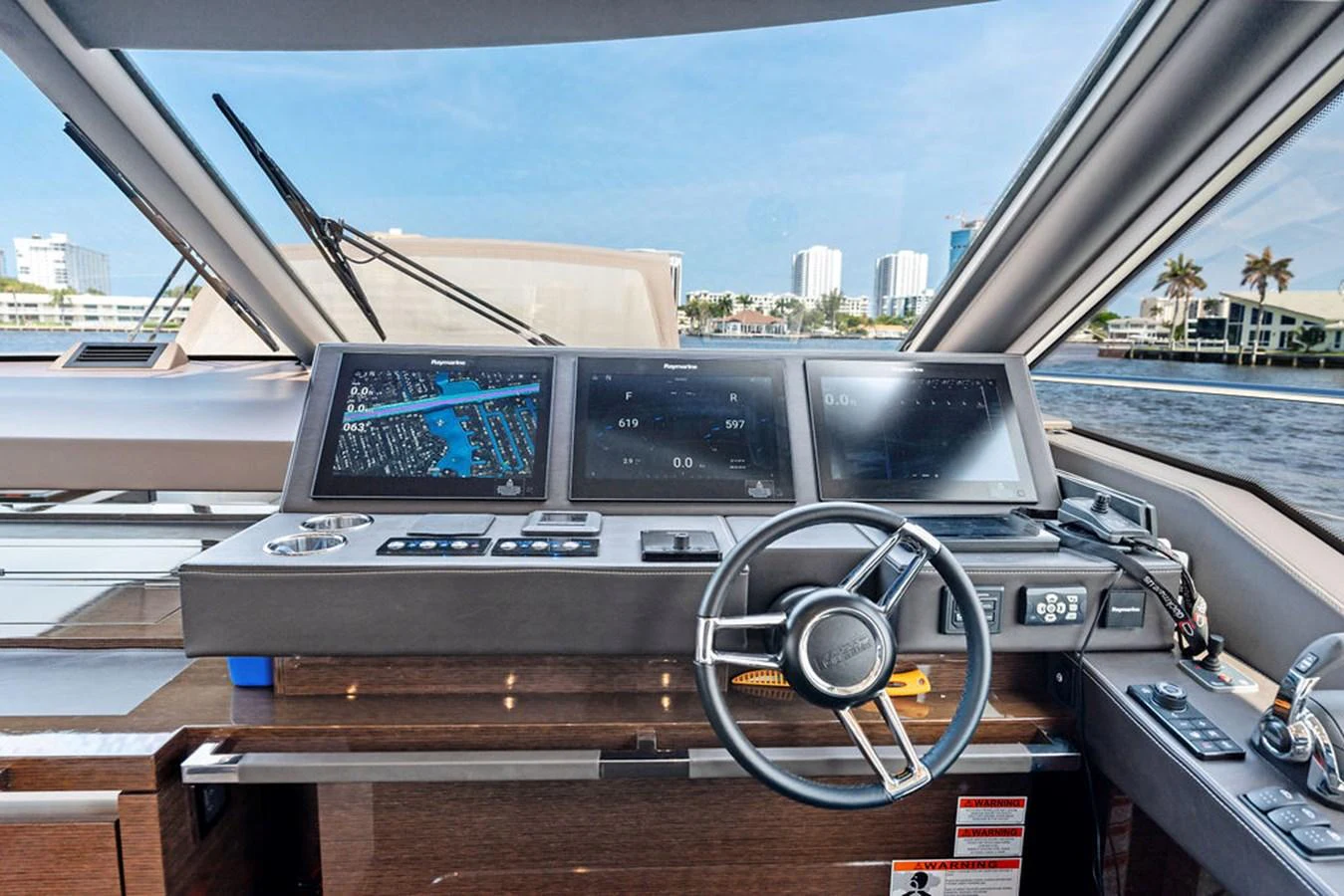 The helm station offers advanced navigation technology with a panoramic view of the water. aboard JOVE Yacht for Sale