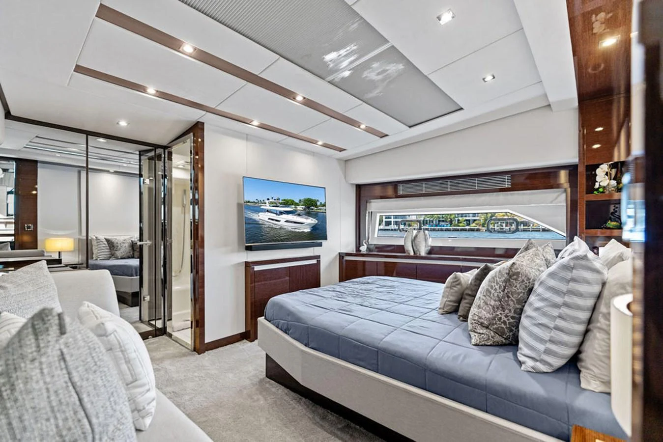The master stateroom features a luxurious bed, ample natural light, and elegant decor. aboard JOVE Yacht for Sale