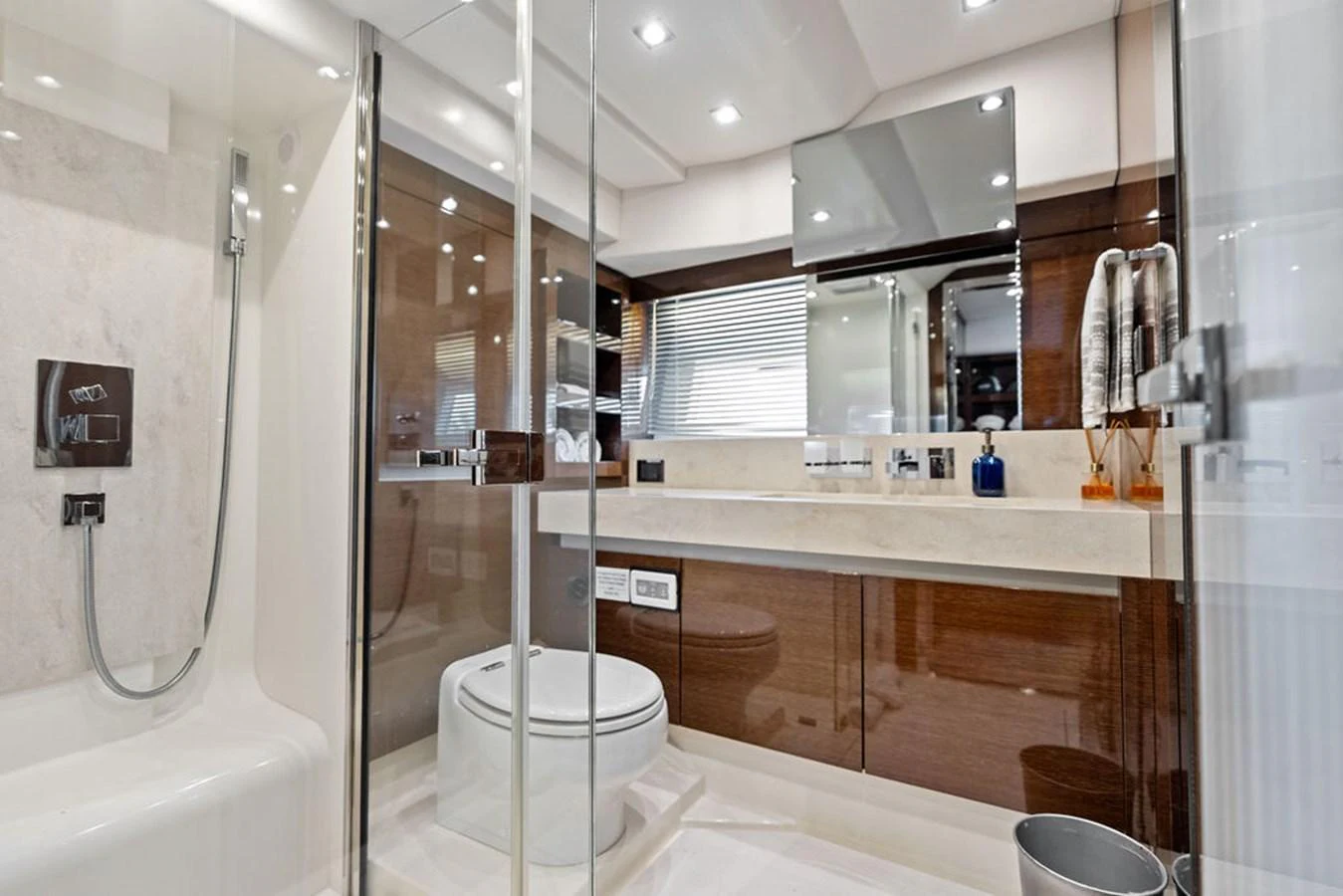 The yacht's bathroom features a modern design with sleek fixtures and ample lighting. aboard JOVE Yacht for Sale