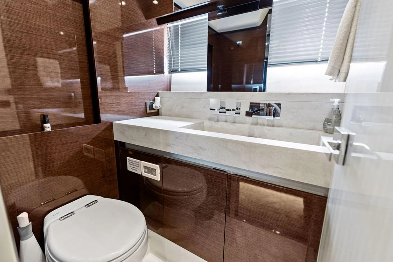 The yacht's bathroom features a sleek design with modern fixtures and a luxurious finish. aboard JOVE Yacht for Sale