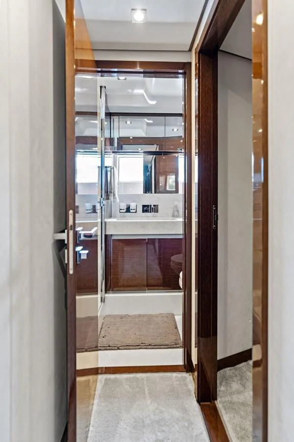 A sleek and modern yacht bathroom with elegant fixtures and a clean design. aboard JOVE Yacht for Sale