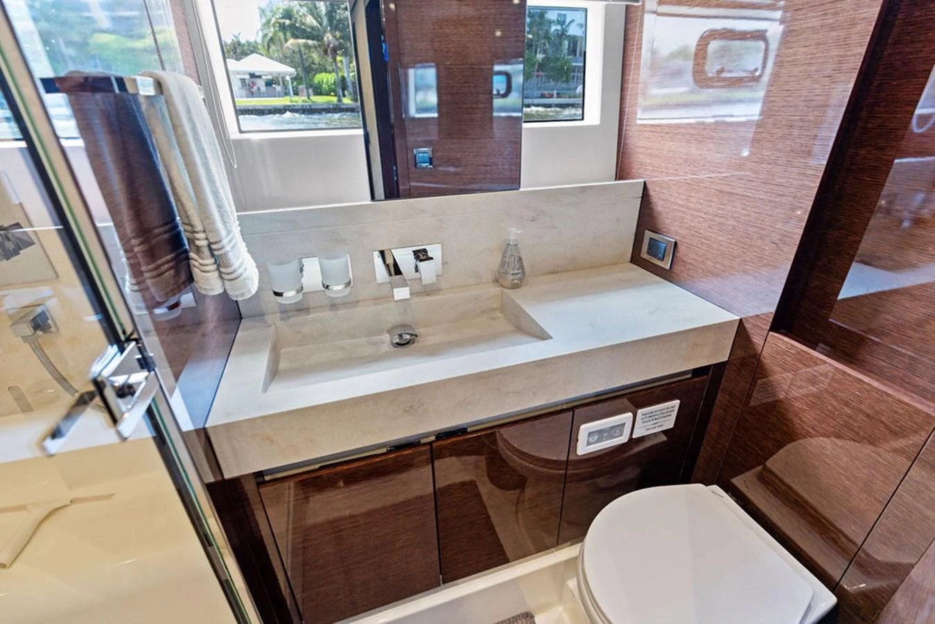 The yacht's bathroom features a sleek, modern design with high-end fixtures and ample natural light. aboard JOVE Yacht for Sale