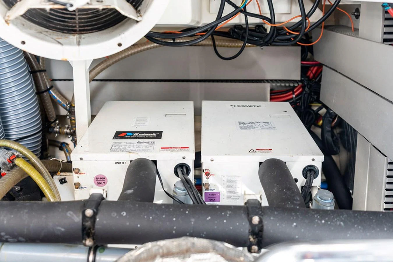 The image showcases the technical equipment and machinery within the yacht's engine room. aboard JOVE Yacht for Sale