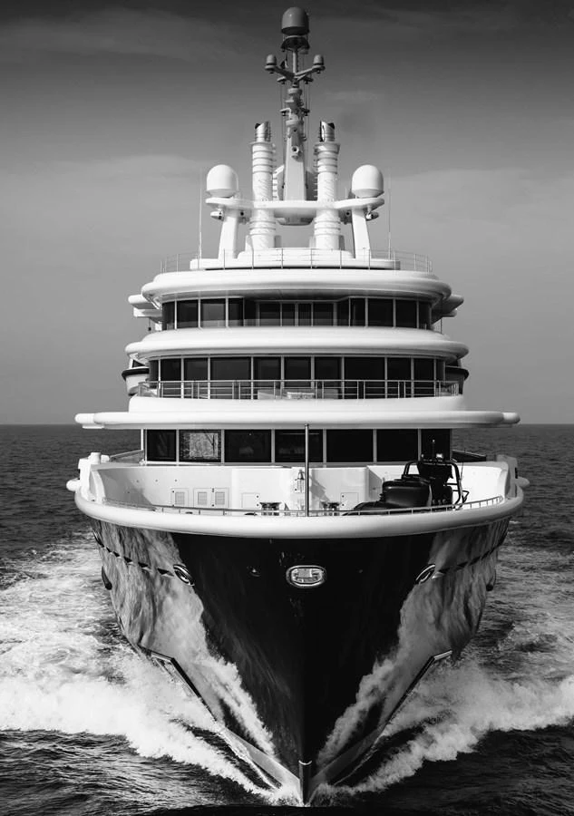 A majestic yacht cuts through the water, showcasing its impressive multi-deck structure. aboard LUNA Yacht for Sale