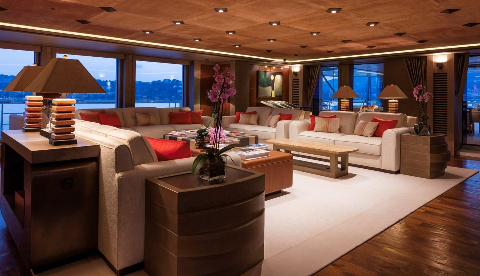 The yacht's salon exudes luxury with its spacious seating area, warm lighting, and elegant decor. aboard LUNA Yacht for Sale
