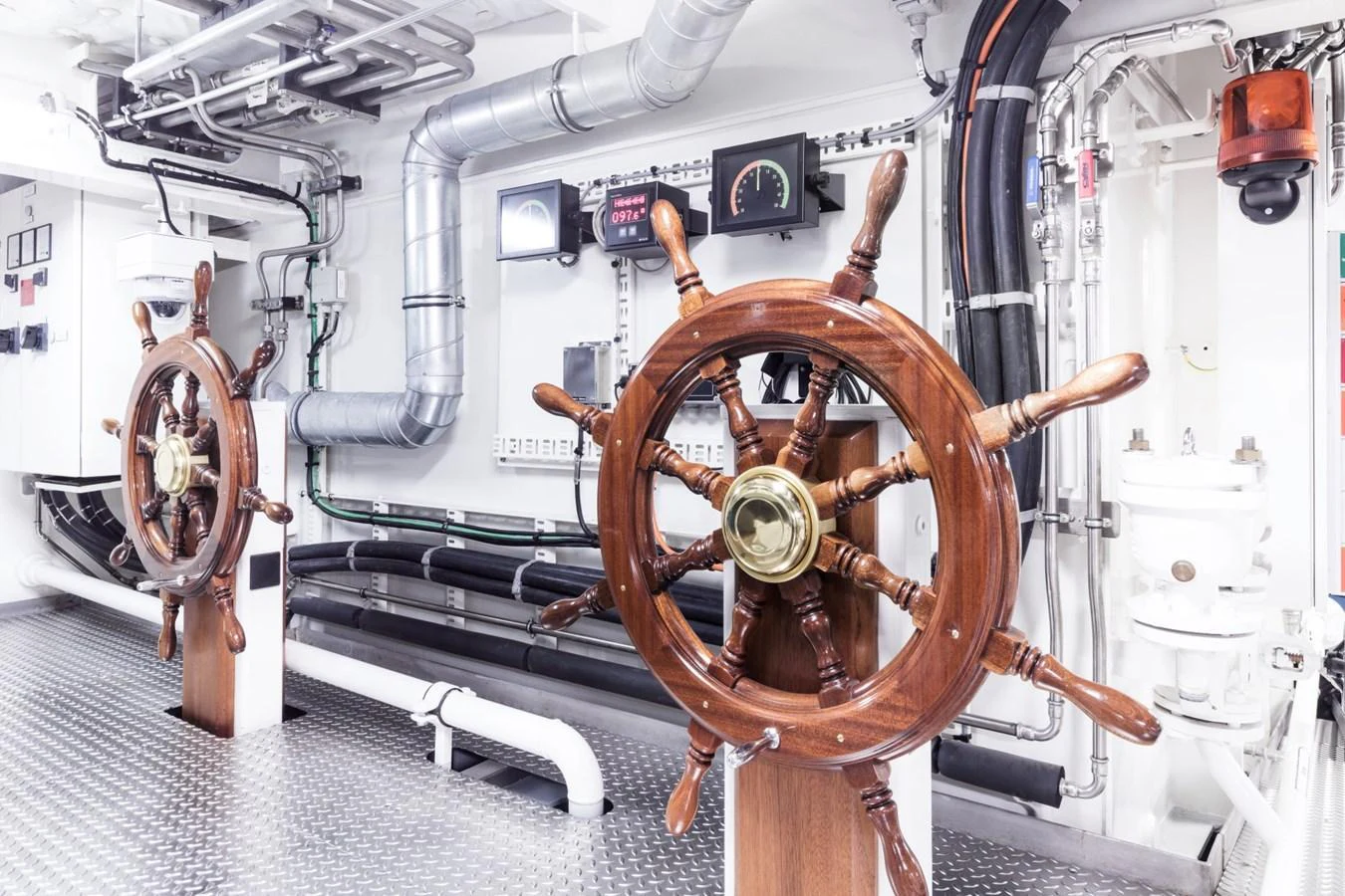 The engine room features traditional wooden ship wheels and modern mechanical systems. aboard LUNA Yacht for Sale