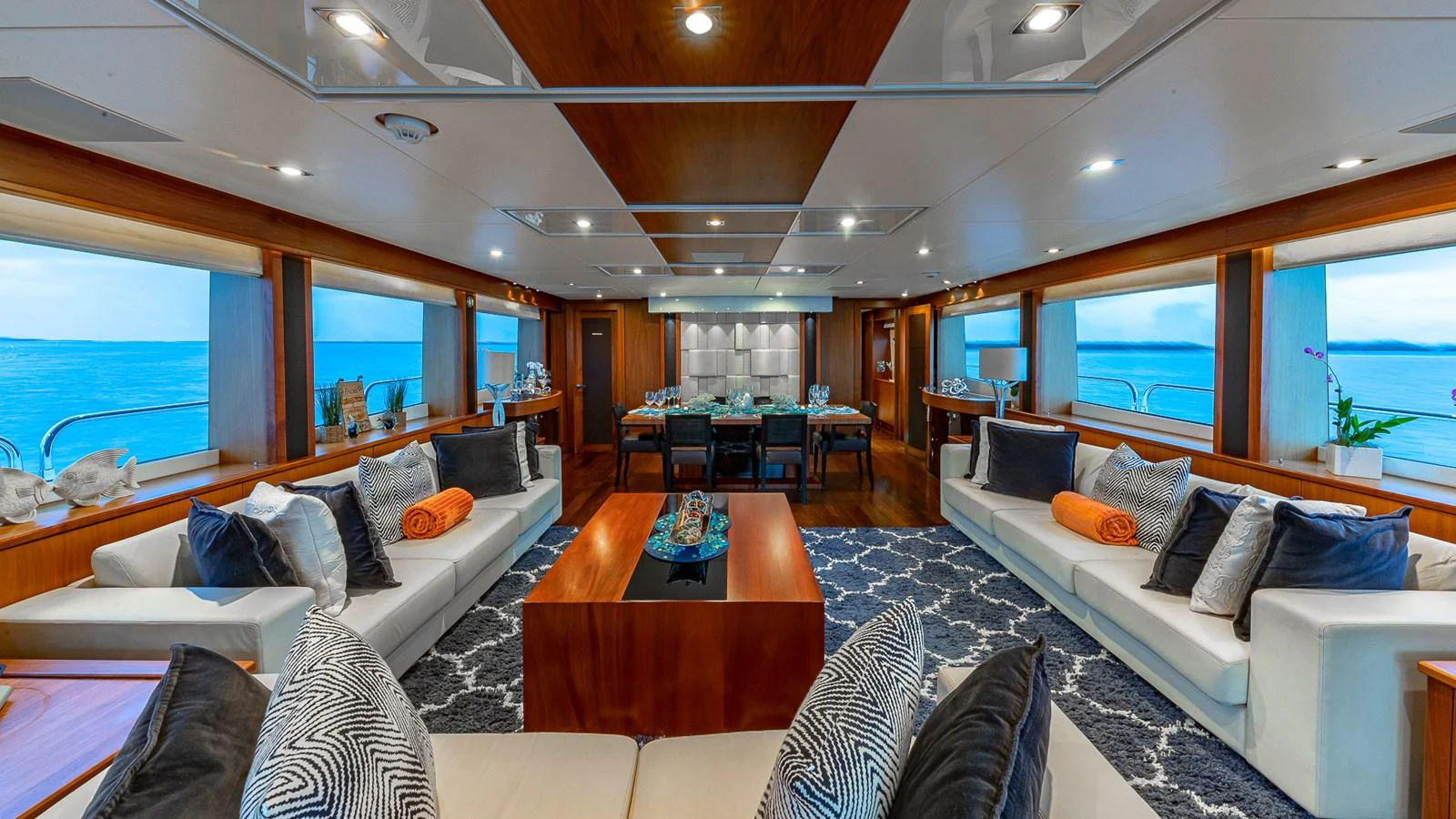a living room with a large window aboard EMRYS Yacht for Sale