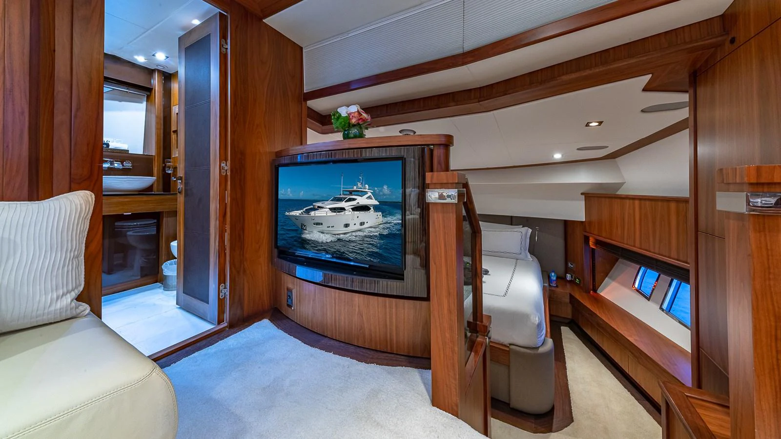 a room with a tv and a couch aboard EMRYS Yacht for Sale
