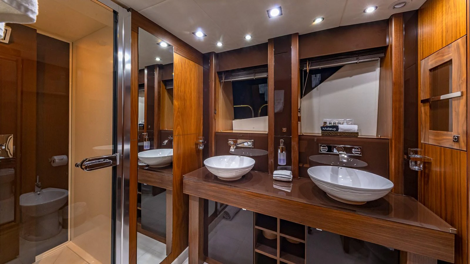 a bathroom with a sink and a mirror aboard EMRYS Yacht for Sale