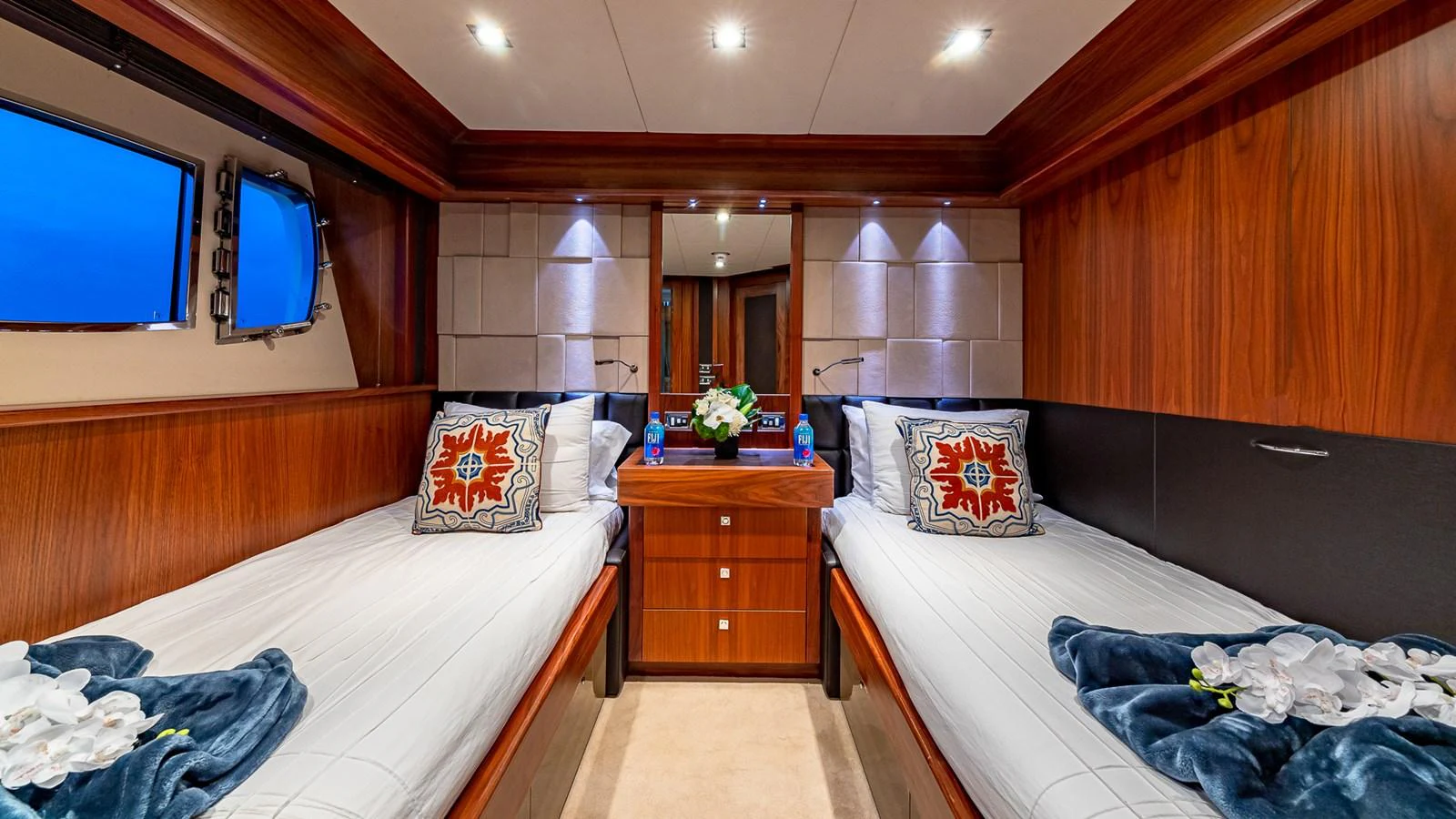 a room with a bed and a television aboard EMRYS Yacht for Sale