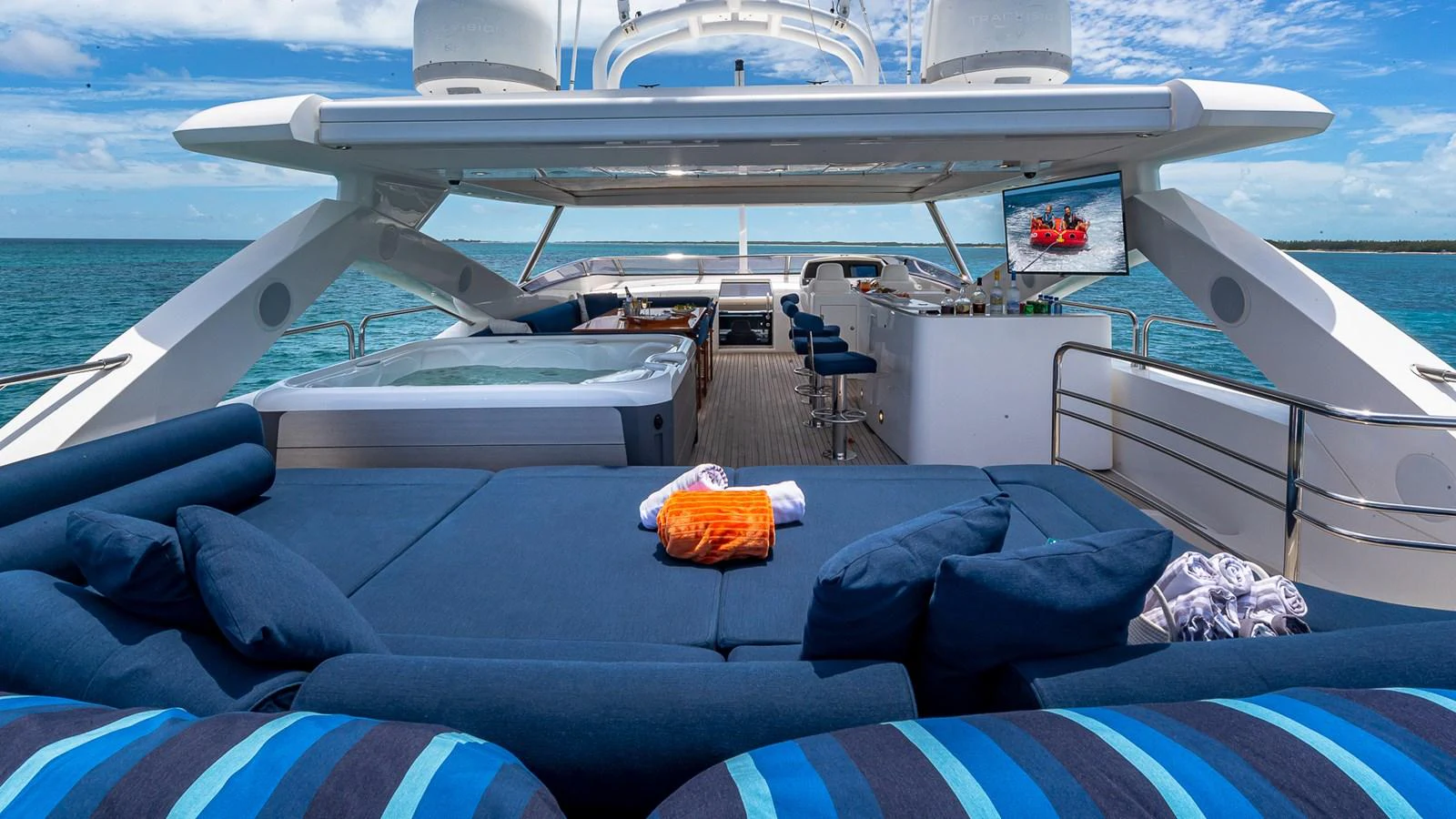 a boat with a blue cover and a blue blanket on it aboard EMRYS Yacht for Sale