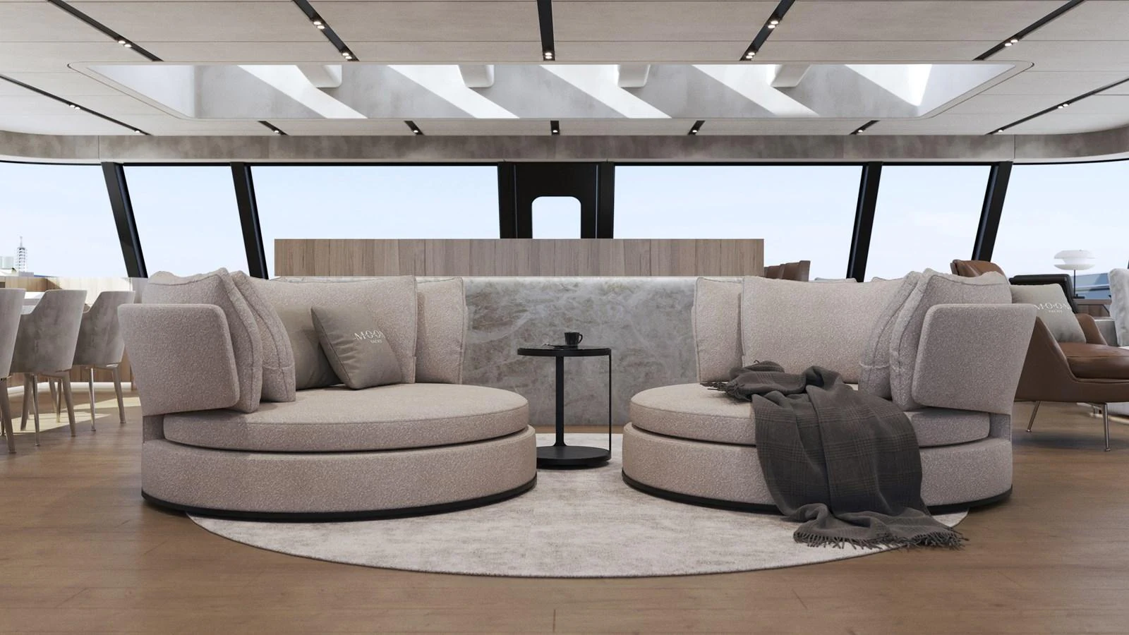 The salon features modern, circular seating with plush cushions and a sleek, contemporary design. aboard MOON YACHT 100 Yacht for Sale