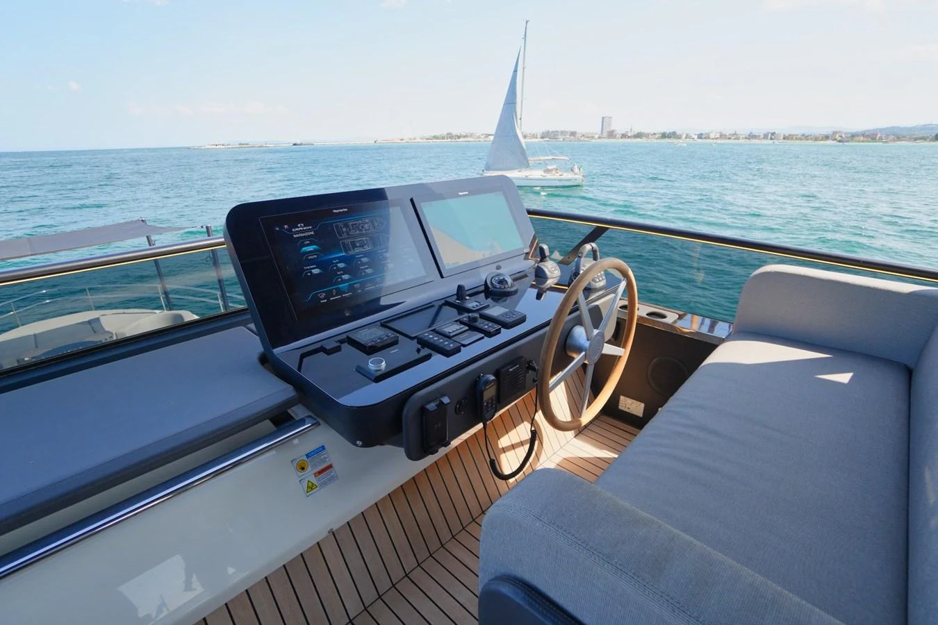 The helm station offers a modern and sleek design with advanced navigation equipment and a comfortable seating area. aboard AMY Yacht for Sale