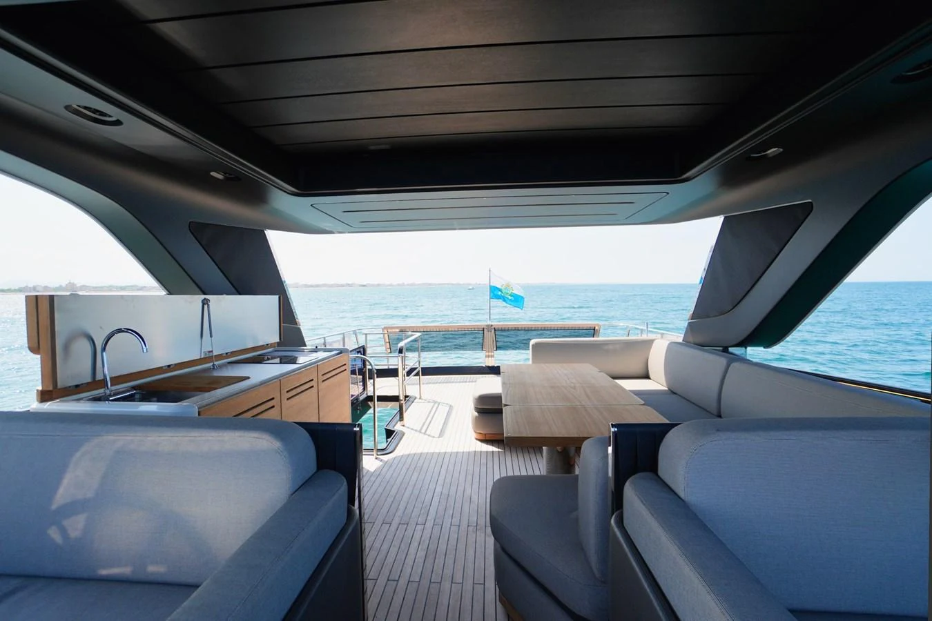 The aft deck offers a spacious and stylish area for relaxation and dining with a stunning view of the sea. aboard AMY Yacht for Sale