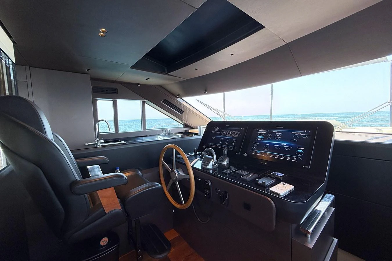 The yacht's helm features state-of-the-art navigation equipment and a commanding view of the sea. aboard AMY Yacht for Sale