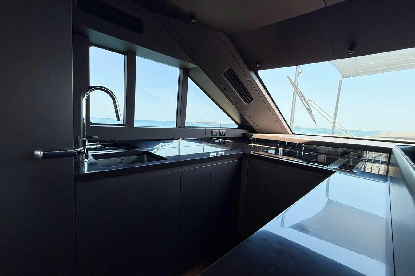 The sleek and modern galley offers stunning ocean views through large windows. aboard AMY Yacht for Sale
