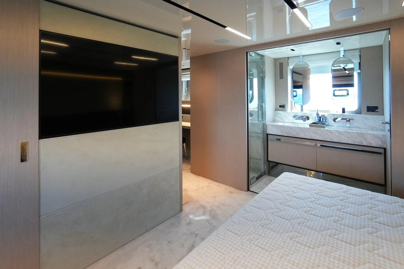 The master stateroom features a luxurious bed and an en-suite bathroom with modern fixtures. aboard AMY Yacht for Sale