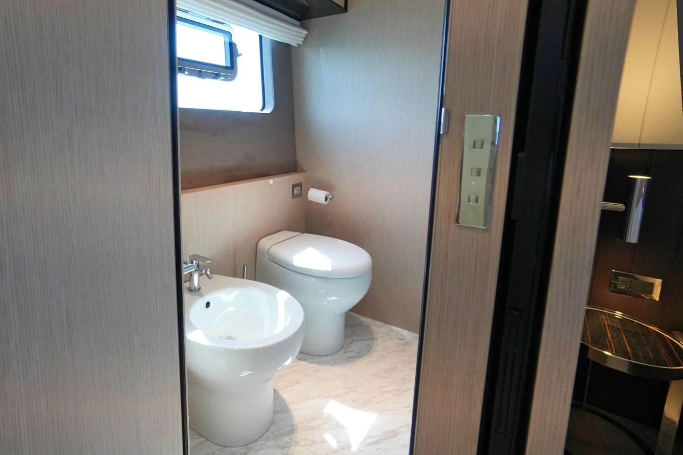 A modern yacht bathroom with a sleek design and natural light. aboard AMY Yacht for Sale