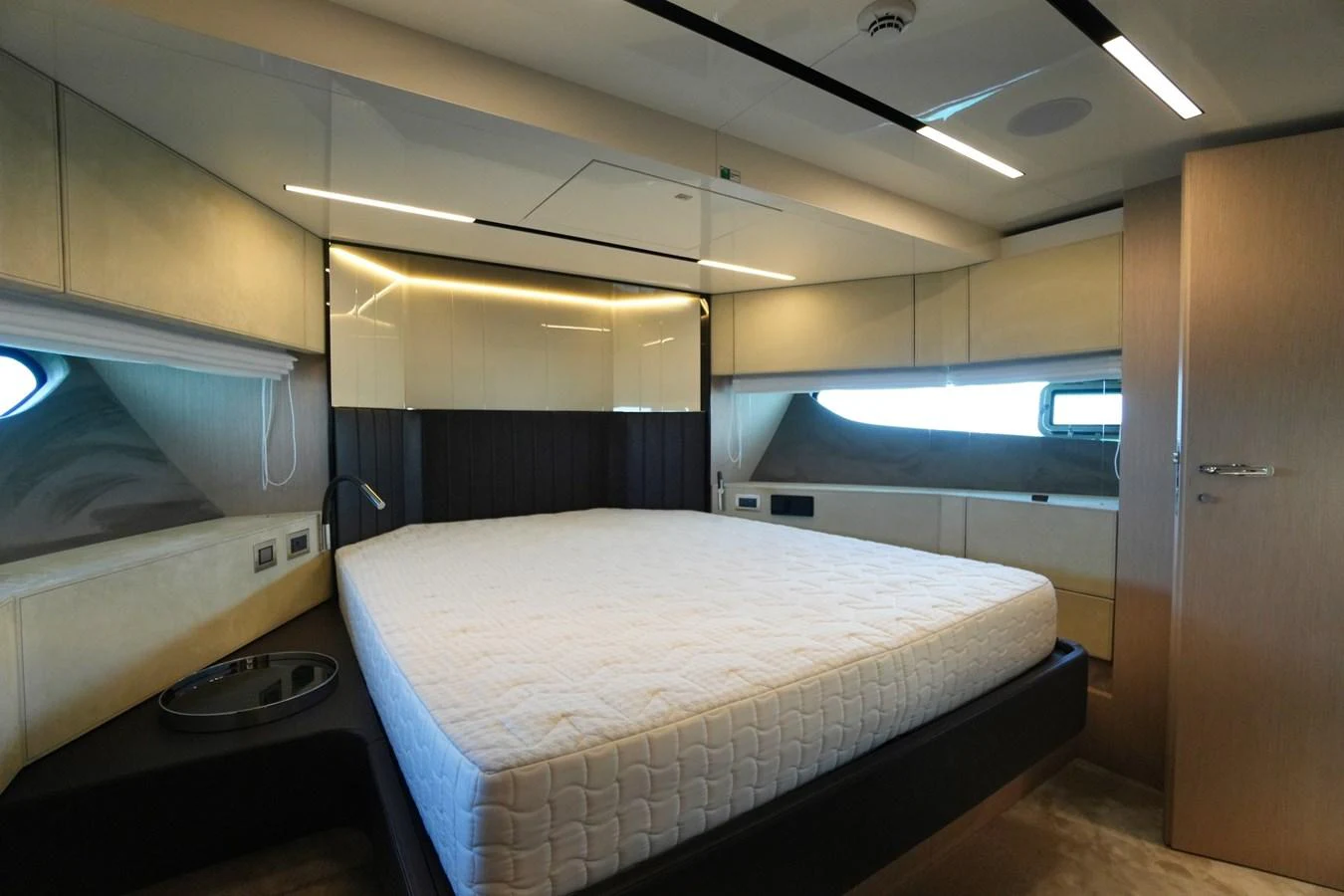 The master stateroom features a spacious bed and modern design elements. aboard AMY Yacht for Sale
