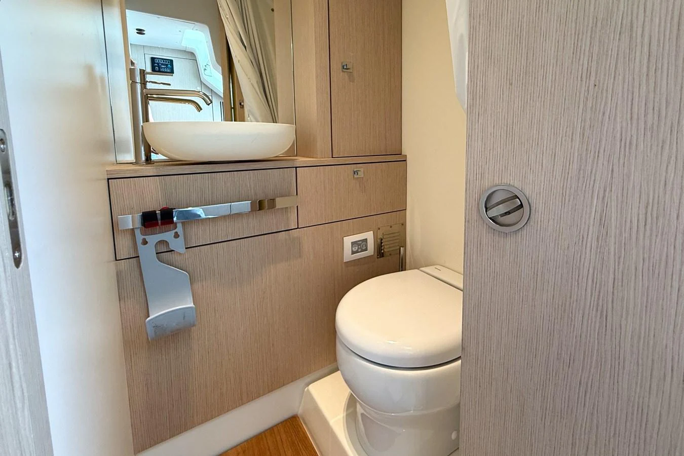 The yacht's head features modern fixtures and a compact, efficient layout. aboard AMY Yacht for Sale