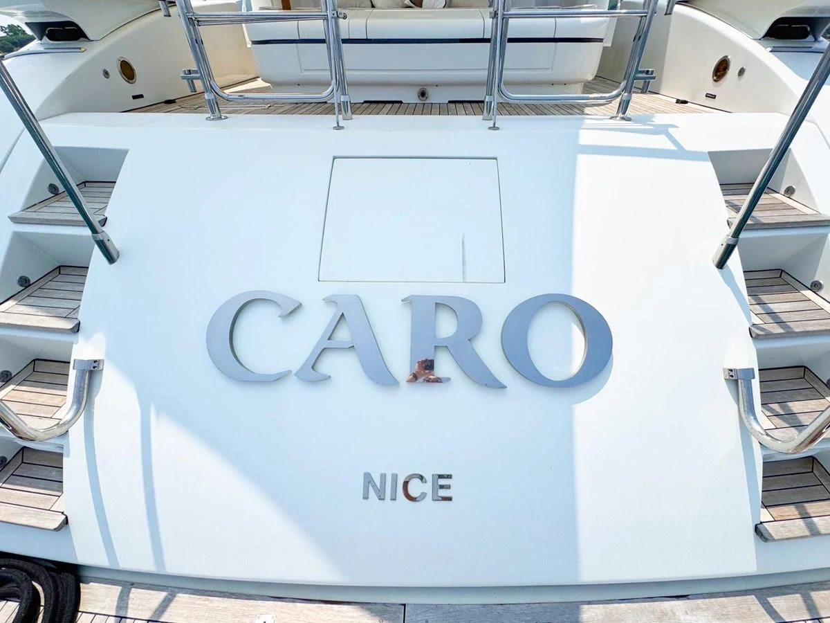 The stern of the yacht features elegant branding and a clean design. aboard CARO Yacht for Sale