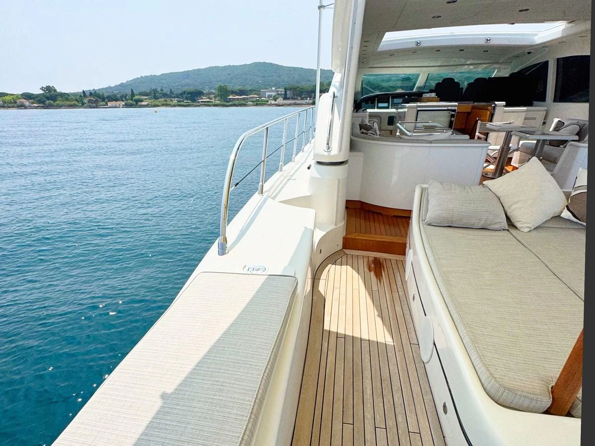 The yacht's aft deck offers a spacious lounging area with comfortable seating and stunning views of the water. aboard CARO Yacht for Sale