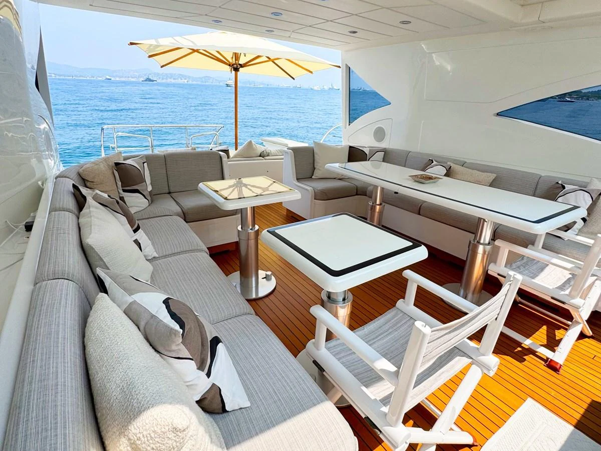 The aft deck offers a spacious and comfortable seating area with a stunning view of the sea. aboard CARO Yacht for Sale