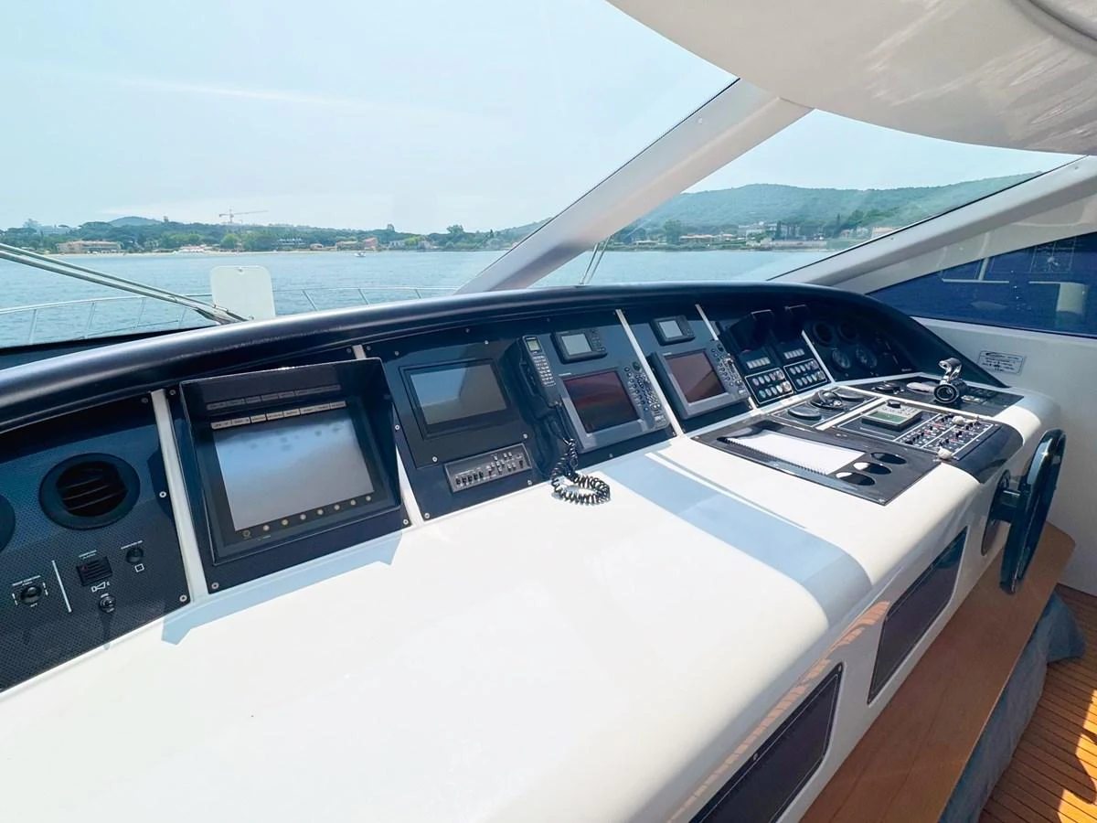 The helm station features advanced navigation equipment and offers panoramic views. aboard CARO Yacht for Sale