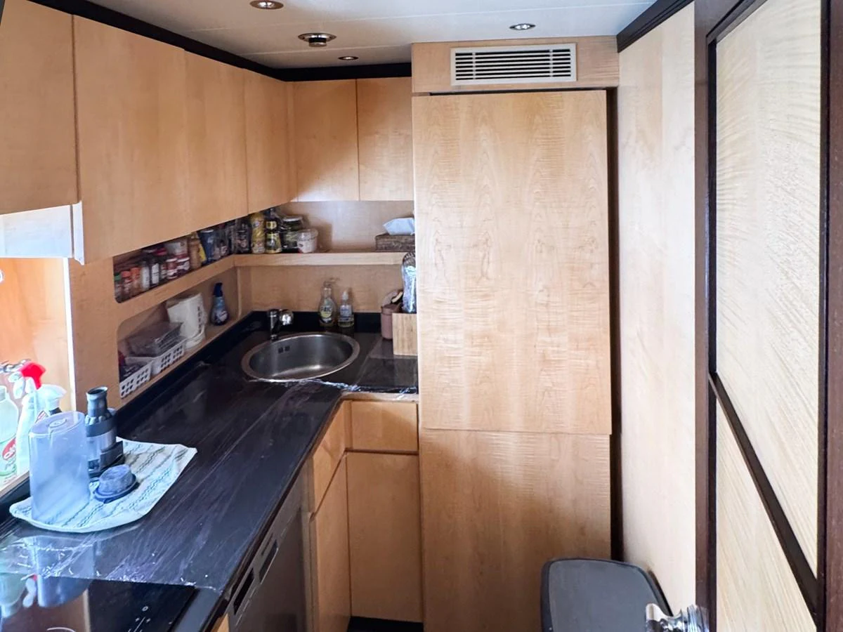 The yacht's galley features modern appliances and ample storage space for a comfortable culinary experience. aboard CARO Yacht for Sale