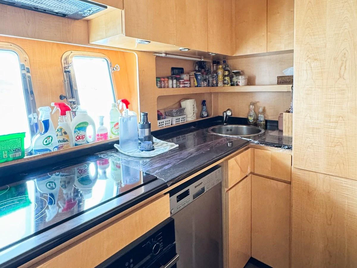 The yacht's galley is equipped with modern appliances and ample storage, ensuring a functional and efficient space for meal preparation. aboard CARO Yacht for Sale
