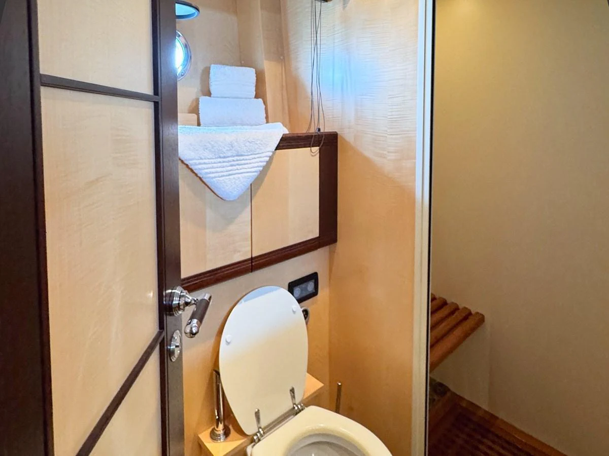 A well-appointed yacht bathroom with modern fixtures and neatly arranged towels. aboard CARO Yacht for Sale