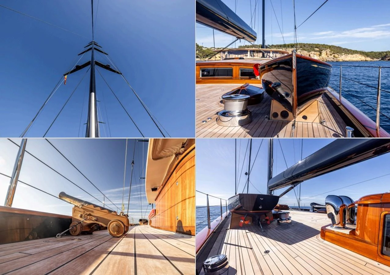 The deck of this yacht showcases elegant wooden finishes and sleek design elements under clear blue skies. aboard MAXIMUS Yacht for Sale