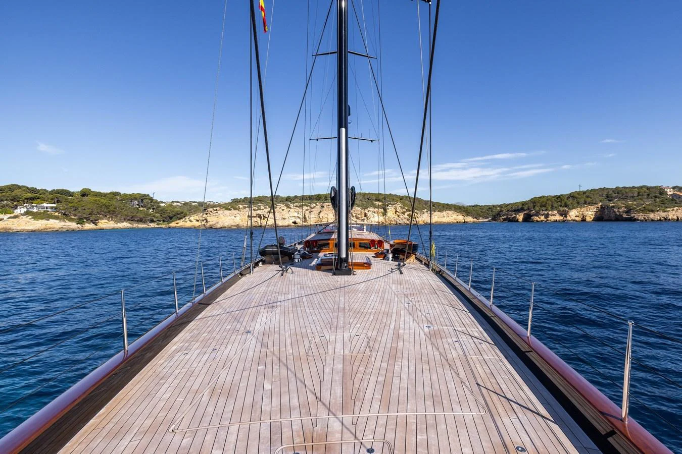 The yacht's expansive deck offers a stunning view of the surrounding waters and coastline. aboard MAXIMUS Yacht for Sale