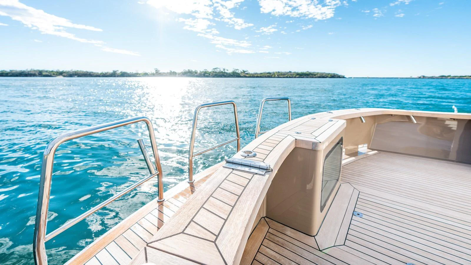 The aft deck offers a serene view of the water with ample space for relaxation. aboard TEXAS T Yacht for Sale