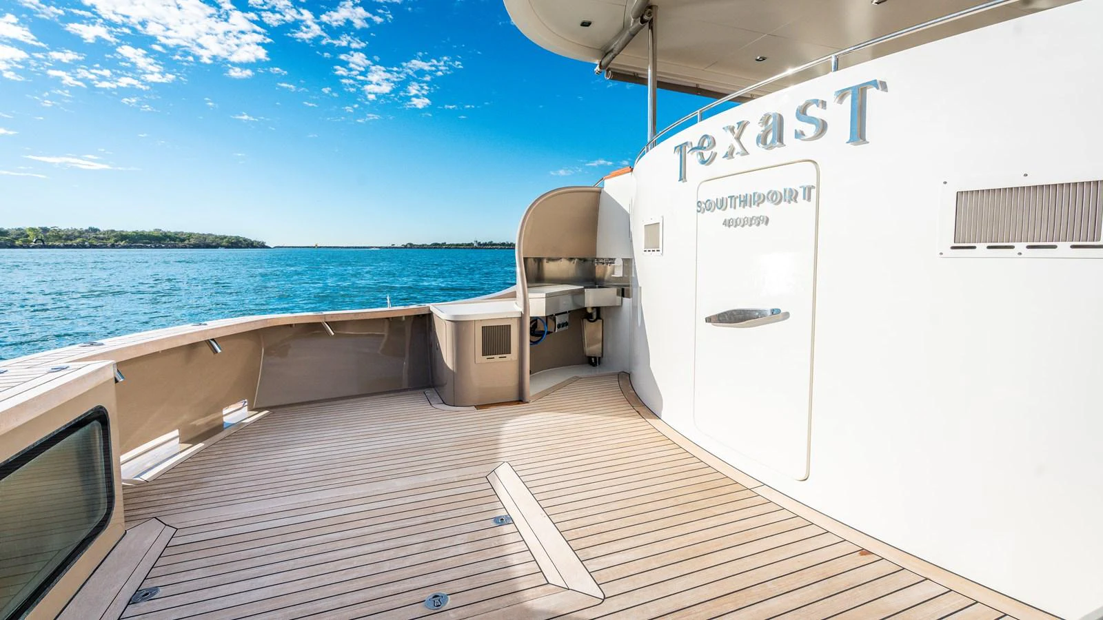 The aft deck offers a spacious and inviting area for relaxation and entertainment with stunning views of the water. aboard TEXAS T Yacht for Sale