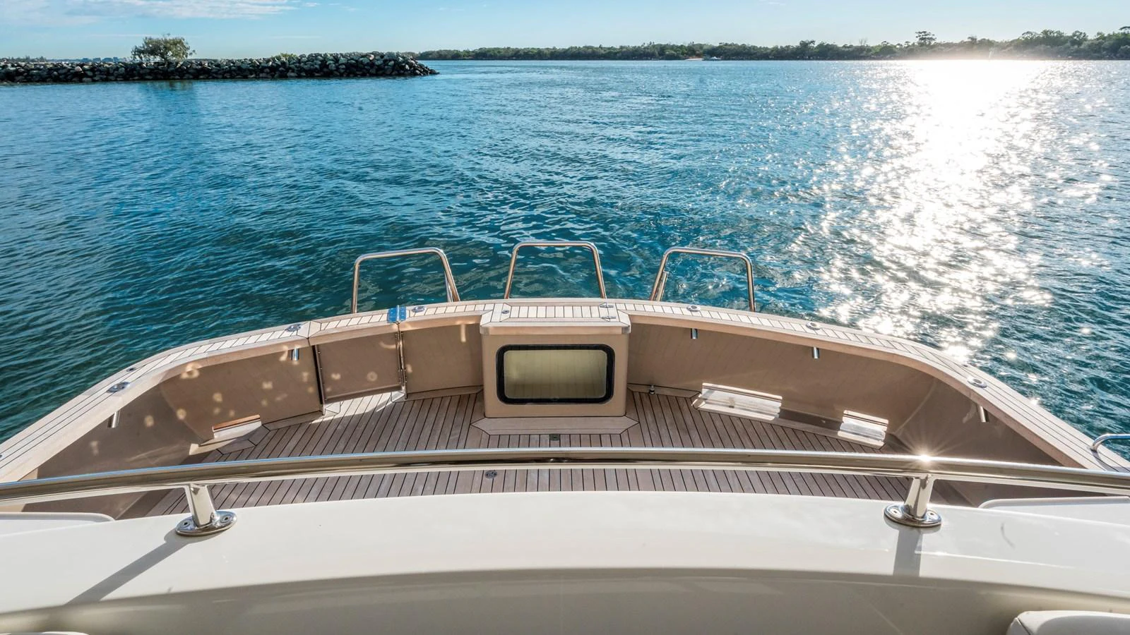 The yacht's aft deck offers a serene view of the water, perfect for relaxation. aboard TEXAS T Yacht for Sale