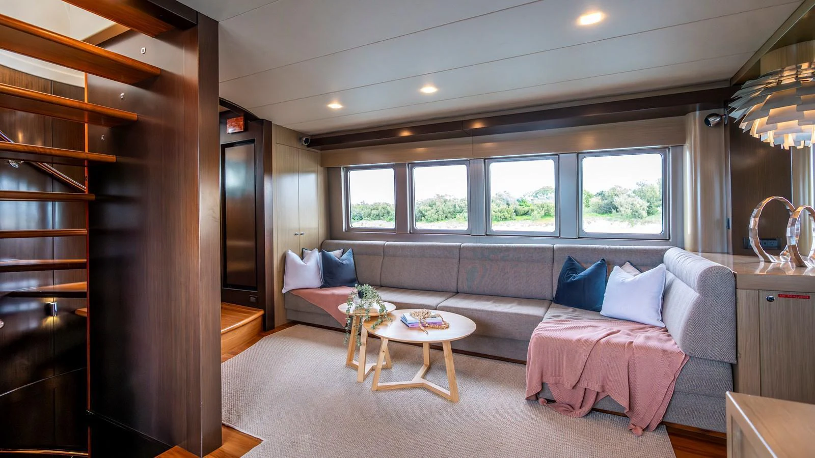 The salon features a spacious and comfortable seating area with large windows offering scenic views. aboard TEXAS T Yacht for Sale