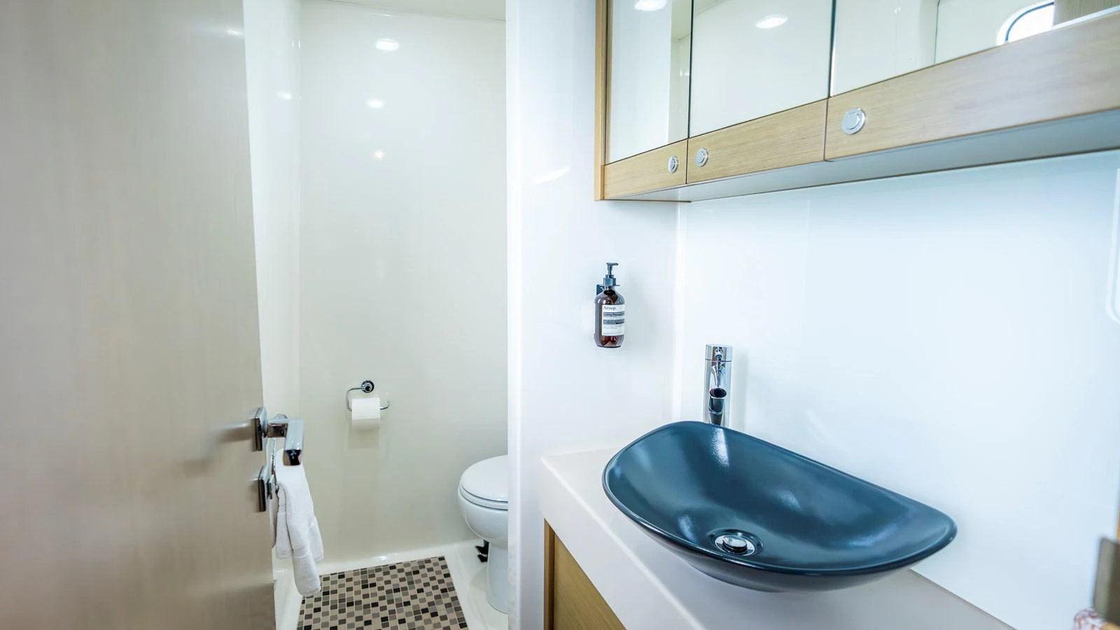A sleek and modern bathroom with a stylish sink and ample storage. aboard TEXAS T Yacht for Sale