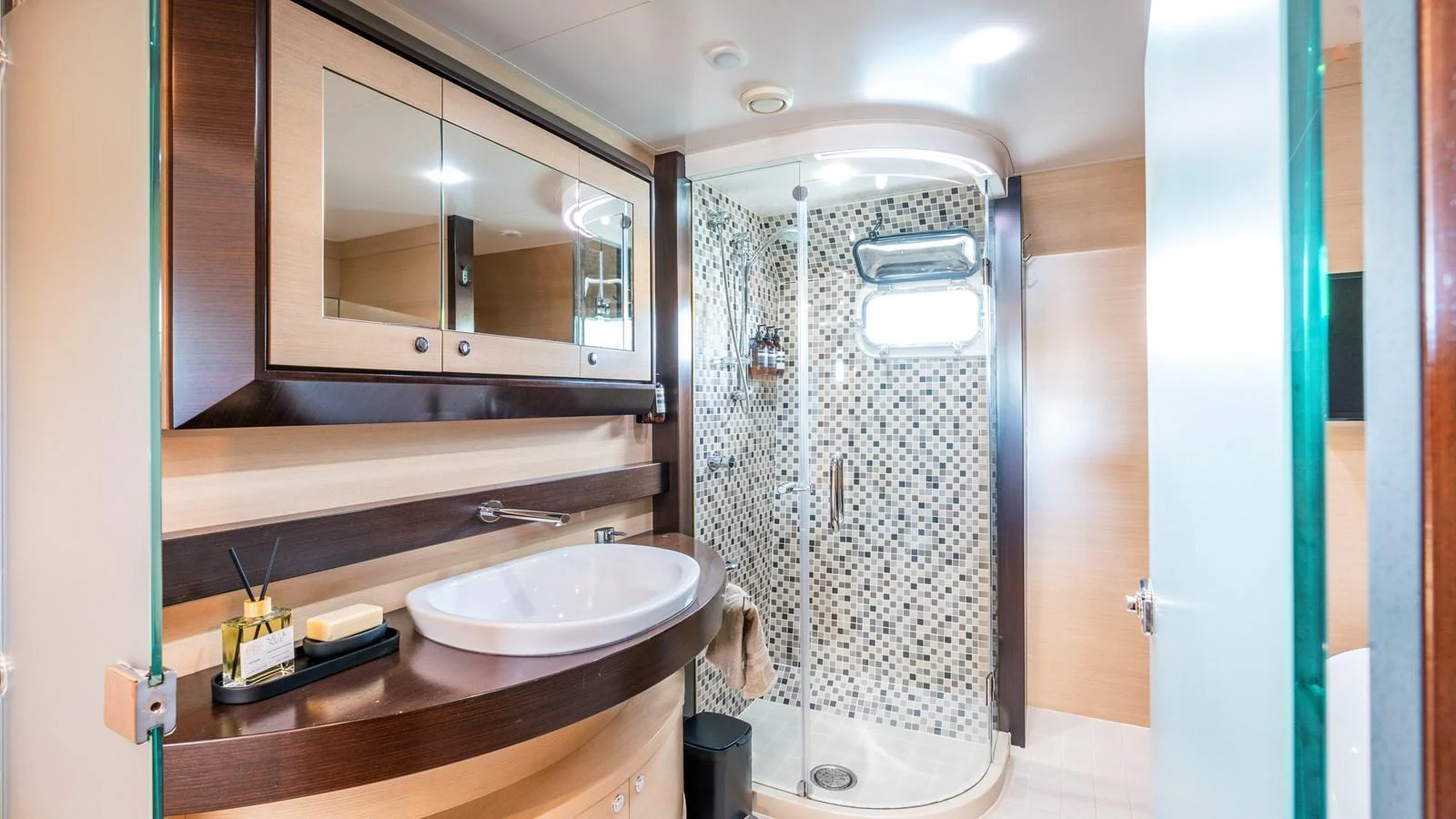 A modern yacht bathroom featuring a sleek shower and elegant fixtures. aboard TEXAS T Yacht for Sale