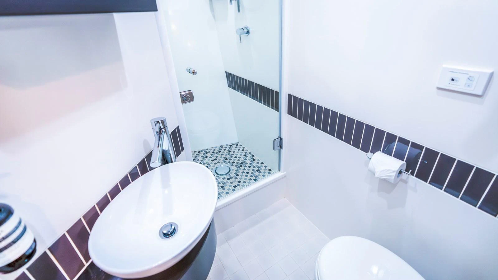 The yacht's bathroom features modern fixtures and a sleek design. aboard TEXAS T Yacht for Sale
