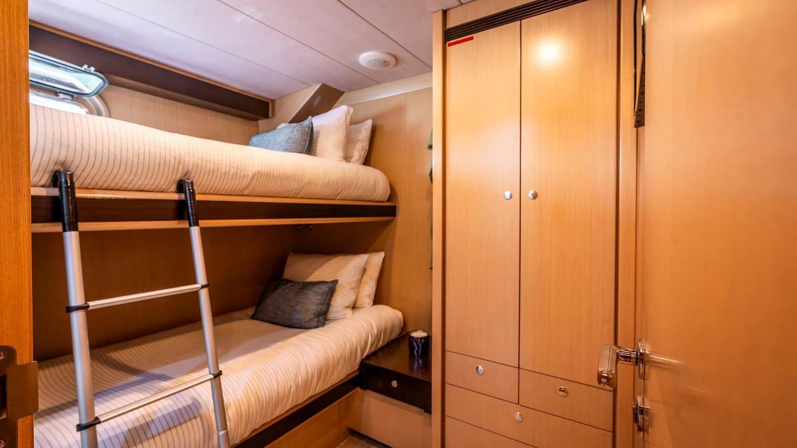 The guest cabin features cozy bunk beds and ample storage space. aboard TEXAS T Yacht for Sale
