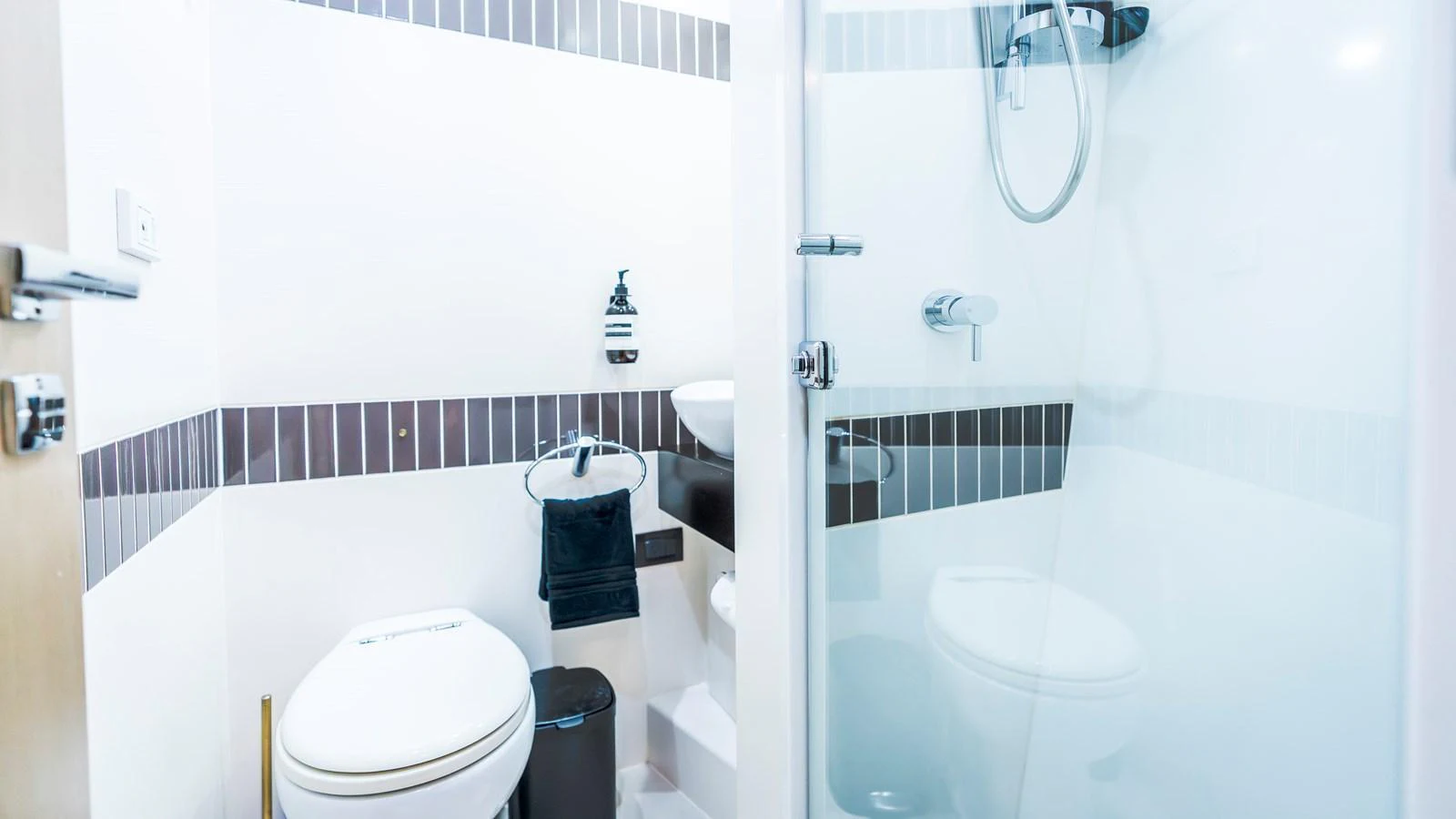 A modern yacht bathroom with a sleek design and contemporary fixtures. aboard TEXAS T Yacht for Sale